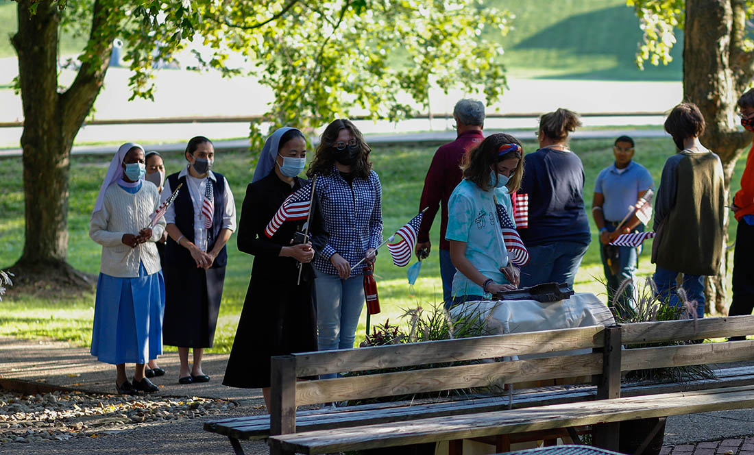 people praying at the saint vincent college sept 11 prayer service